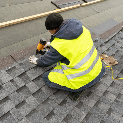 a workman installing a roof